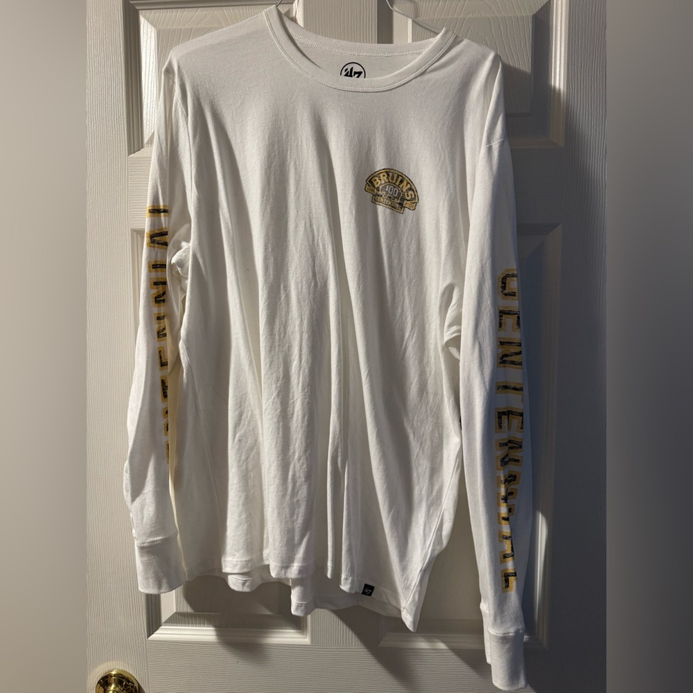 Boston Bruins White Long Sleeve Shirt with lettering on both sleeves. NWT